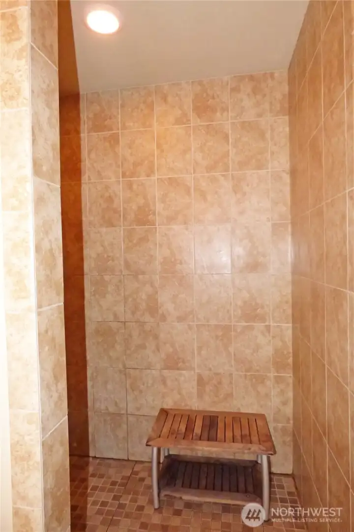 Large walk-in, tiled shower.
