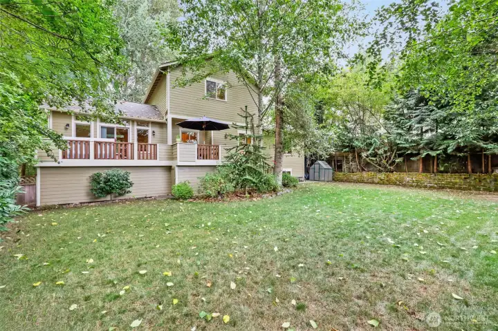 Nice big, fenced back yard with gates on each side of the house. More storage under the deck (see next pic).