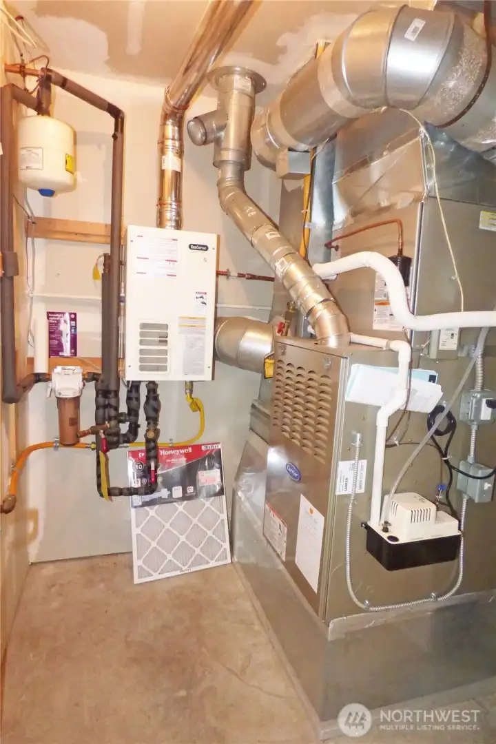 Mechanical room housing the furnace and on demand hot water tank.