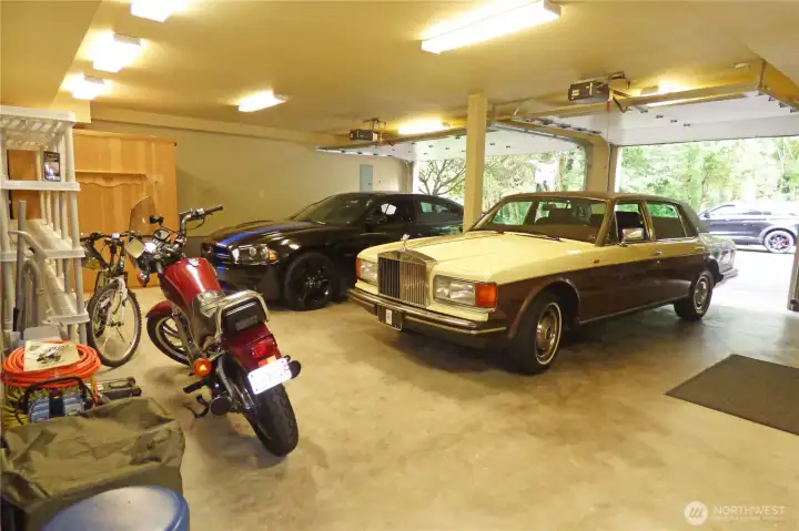 Large, finished 3 car garage (924 sq ft) with garage door openers. Note all the extra room for another car, shop, ???