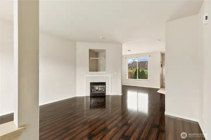 Open the front door to gleaming floors,  high ceilings and lots of light.  And an inviting gas fireplace to cozy up to in the winter.