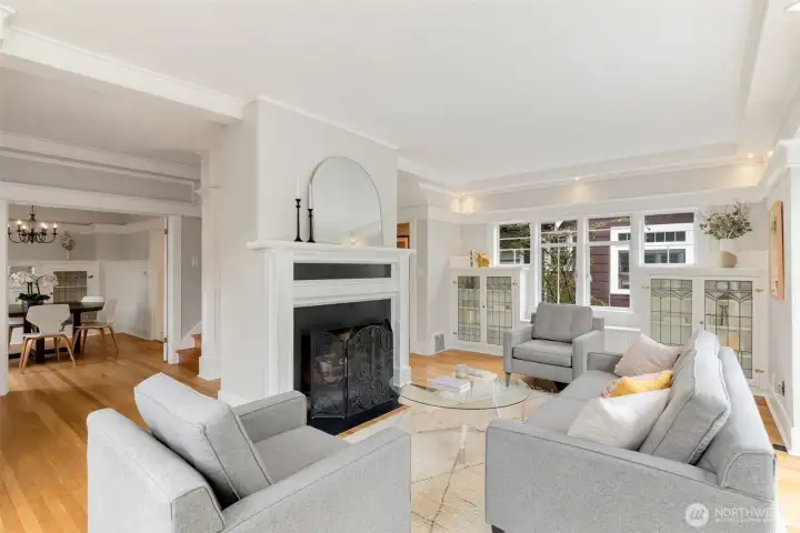 Gracious light-filled living room with built-ins both functional and beautiful.