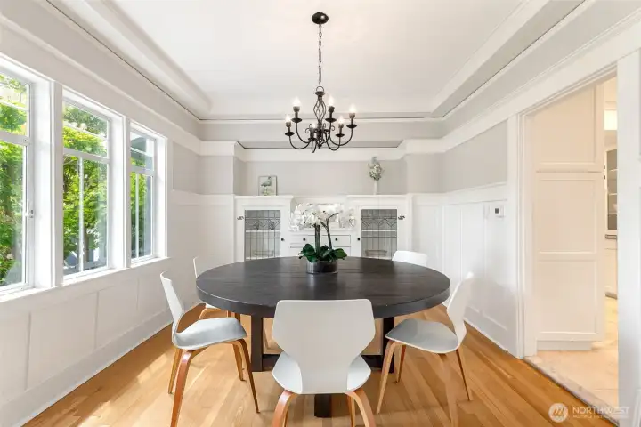 Formal dining room with a wall of built-ins..