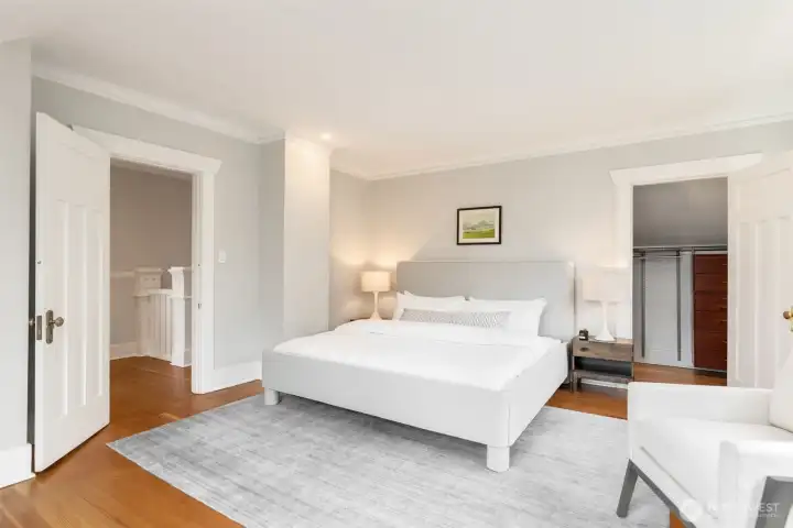 Upstairs primary bedroom with a surprisingly roomy walk-in closet.