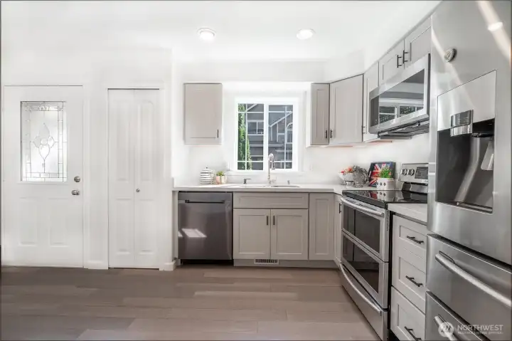 Remodeled kitchen with new cabinets and sleek countertops