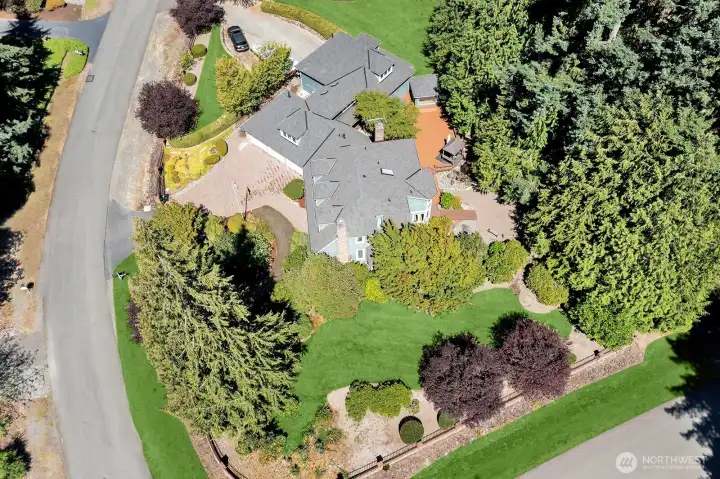 Property is fenced with brick & metal fence with remote operated gates