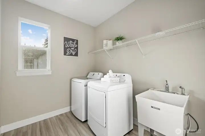 Laundry room with utility sink.