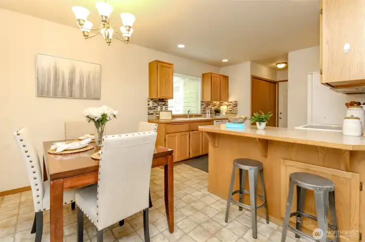 Open and spacious kitchen with oak cabinets