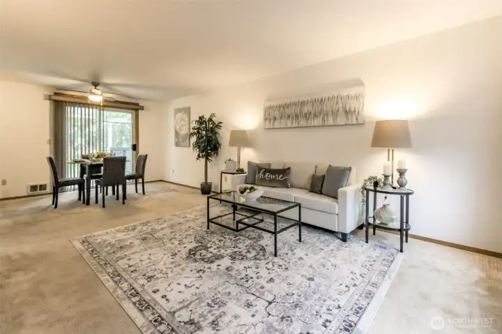 Living room just off entry with dining room that leads to the covered deck and backyard.