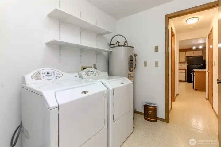 This angle of the dining room shows the hall to the half bath, garage entrance and kitchen. This placement makes it nice to shut the door and block it off from main floor.