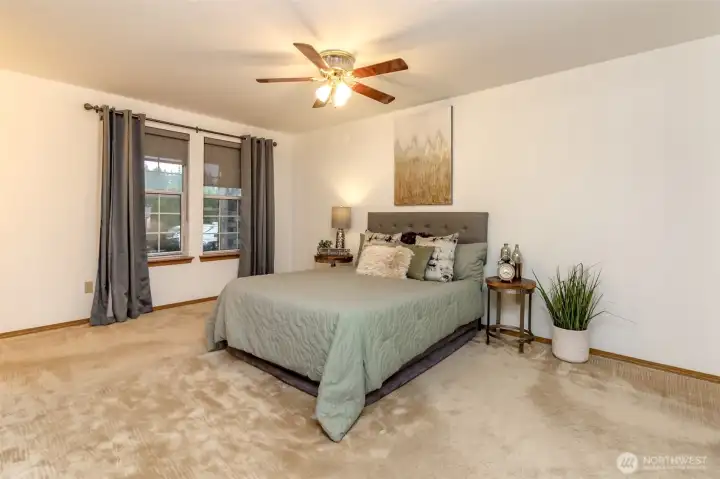 Primary bedroom is very spacious and overlooks the front yard. Walk i closet and full bath accompany this primary bedroom.