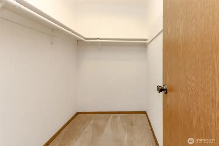 Primary bedroom's walk in closet.