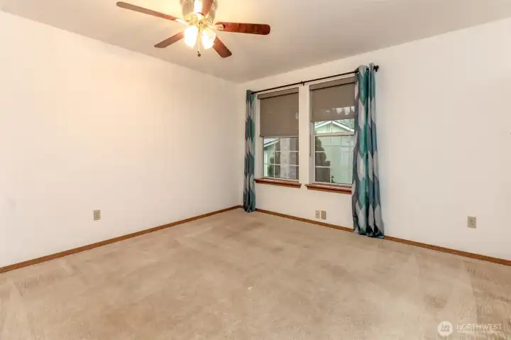 Extra bedroom faces the front of the yard.