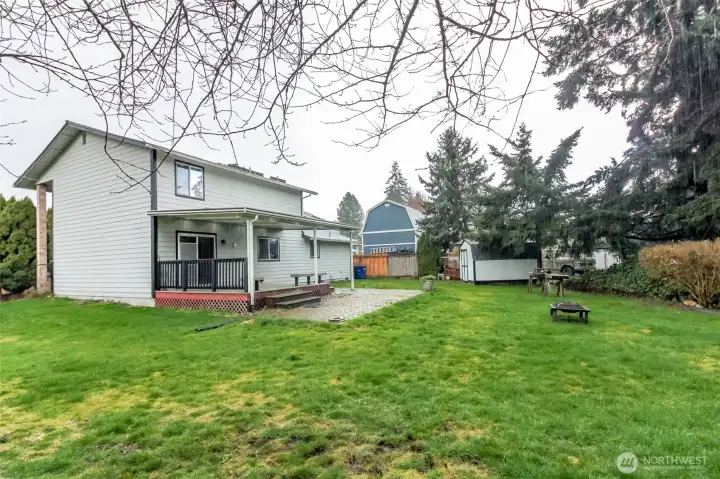 Wide angle shot of yard from back of house.