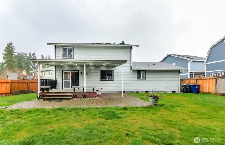 Straight on view of backyard and deck.