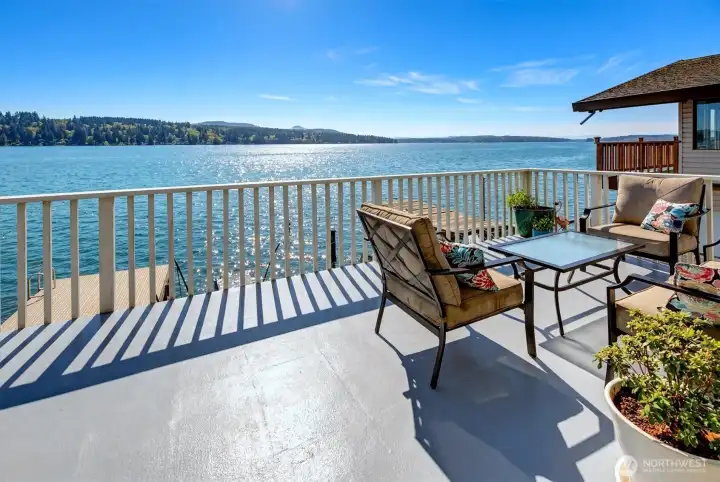 Outside deck with sweeping eastern lake and mountain views