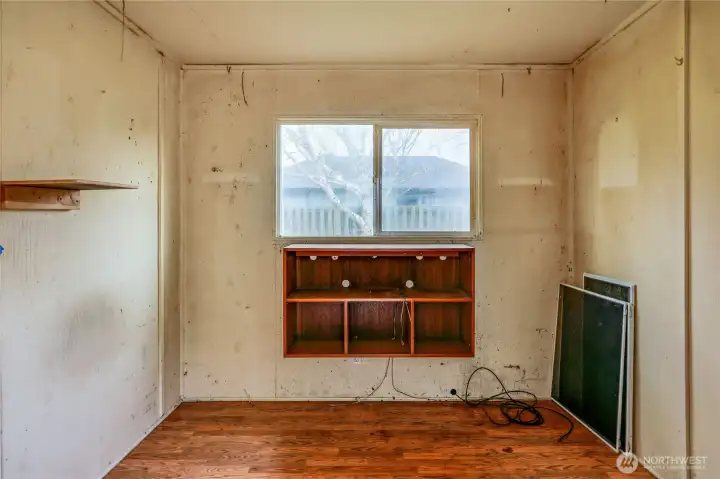 A sturdy outbuilding with a window and power