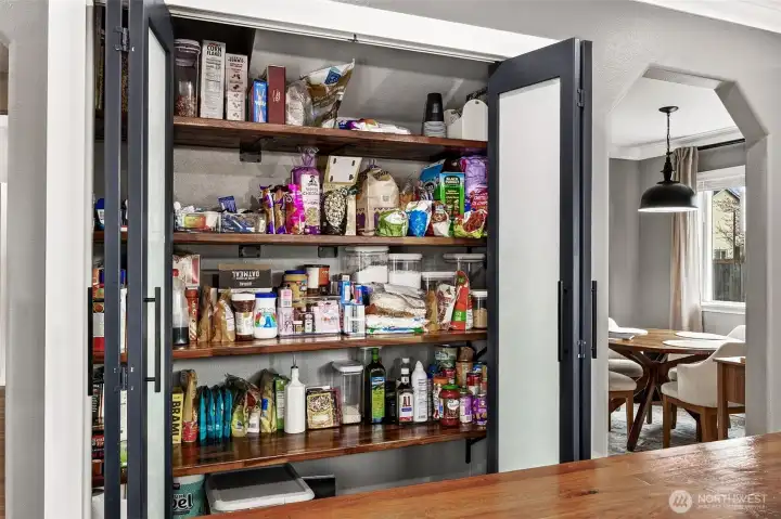 Nice sized pantry for this home with black walnut shelves & frosted glass bi-fold doors.