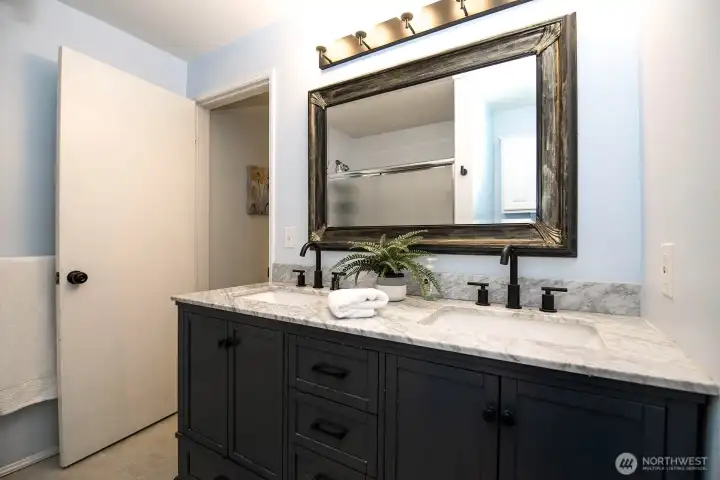 Full bathroom on upper level with dual sink vanity
