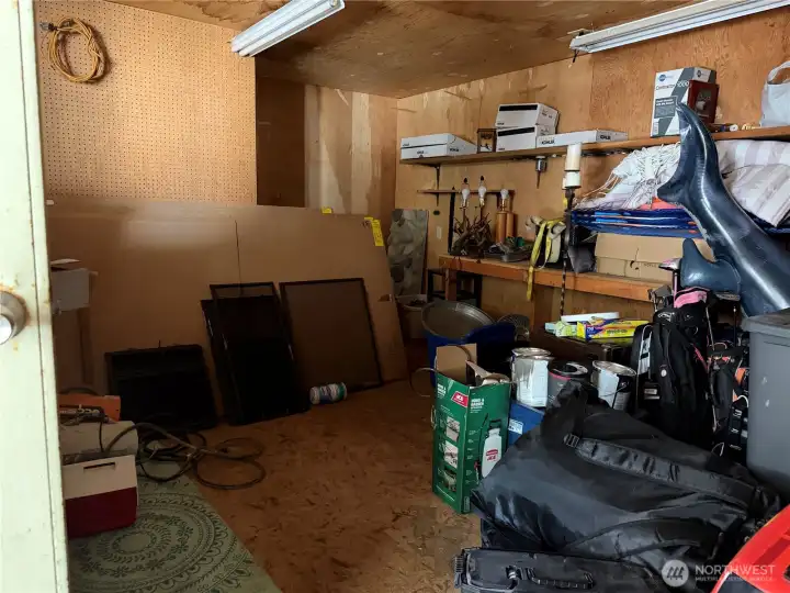 Inside the shop room at the back of the garage.