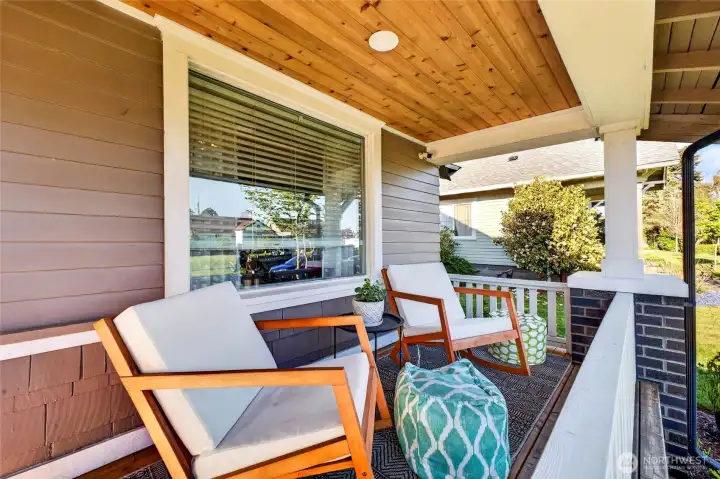 Large covered front porch with view of Mount Rainier on sunny days!