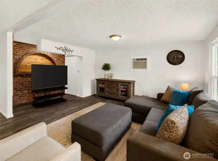 Filled with natural light and designed for everyday comfort, this inviting living space offers a welcoming atmosphere with updated finishes and an easy flow throughout the home. The expansive seating area creates the perfect place for movie nights, conversations, or simply unwinding at the end of the day.