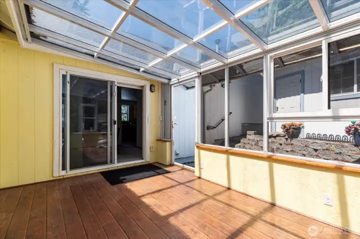 Connected sunroom for indoor/outdoor enjoyment during all seasons.