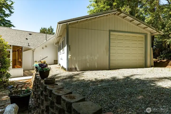 Garage has separate entrance from a back alley shared with a neighbor.