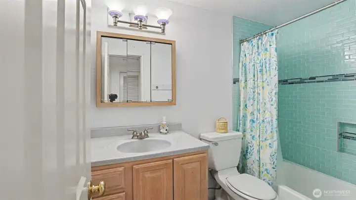 Upstairs full bath with new tile. Upstairs full bath with new tile.