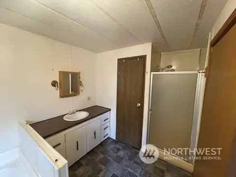 Master bath with shower and  jetted  tub