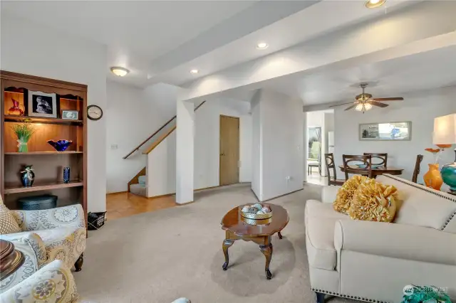 Open living room with impressive lighting...