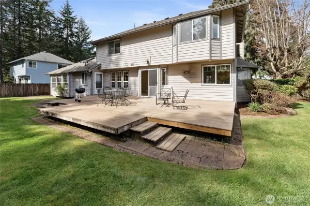 Back of the house, fully fenced yard and a big deck.