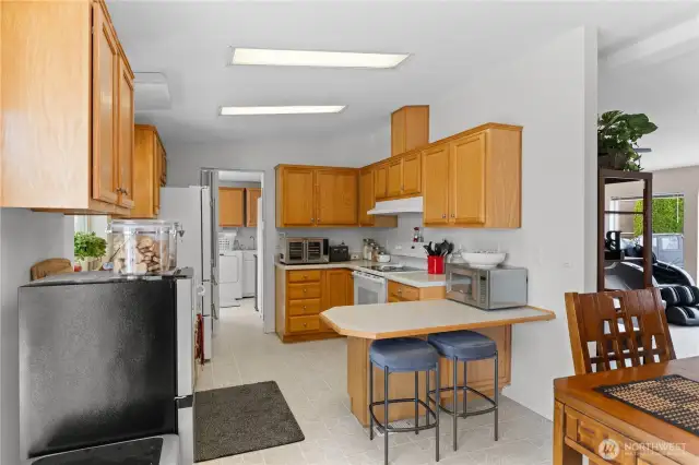 Kitchen with eat in space.
