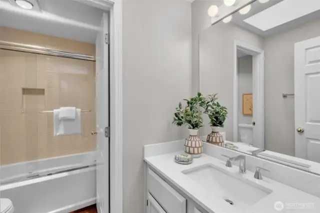 2nd full bath, remodeled, serving the 3 secondary bedrooms. Quartz countertop and undermount sink for elegance and easy maintenance.