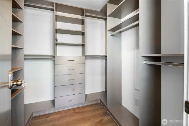 Large Walk-ins outfitted with custom California Closet Designs.