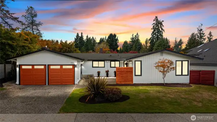PERSONALITY WITH A SPICY FLAIR | Welcome to the Hummingbird Lane house. So fresh with it's new pumpkin-colored garage doors, exterior paint, landscaping and fence. This mid-century modern home blends good bones with modern style.
