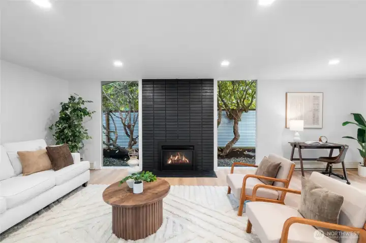 LIVING ROOM | Enjoy the ambiance and warmth of a brand-new gas fireplace insert while you relax in this enchanting space.