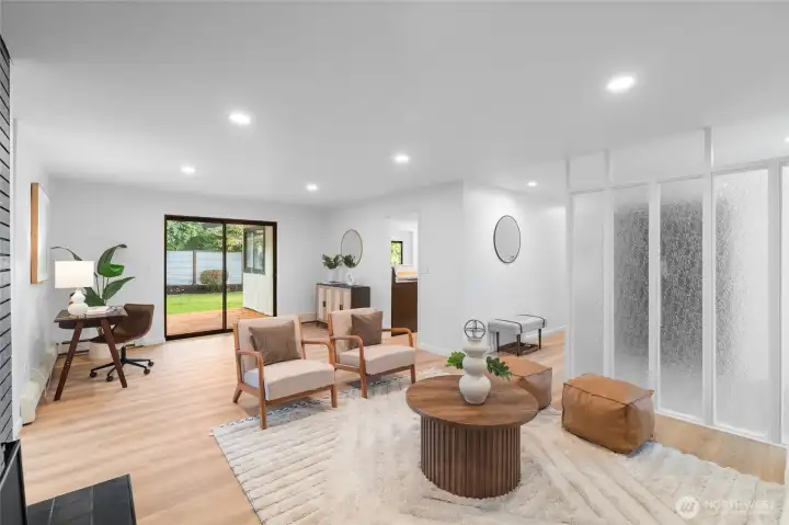 LIVING ROOM | From another angle of the living room you can see and appreciate the space and connectivity as well as the homage to the era the home was built. The original privacy screen is a throwback to 1968.