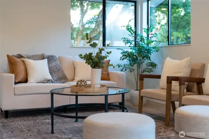 PERFECT PEACEFUL CORNER | Curl up in this corner of the family room with a cup of coffee and your laptop and pretend you're working while you get distracted by the surrounding beauty.