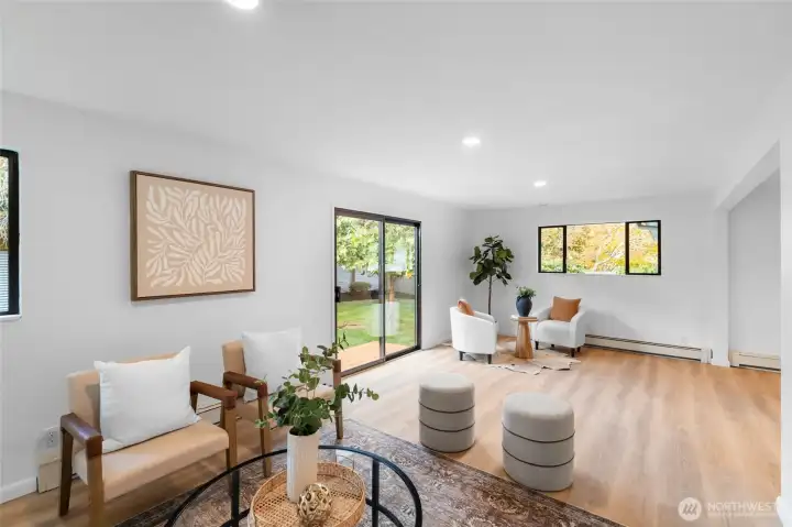 FAMILY ROOM | From another angle of the family room you get a sense of the space and connection. The windows allow such beautiful views and bring the outdoors in.