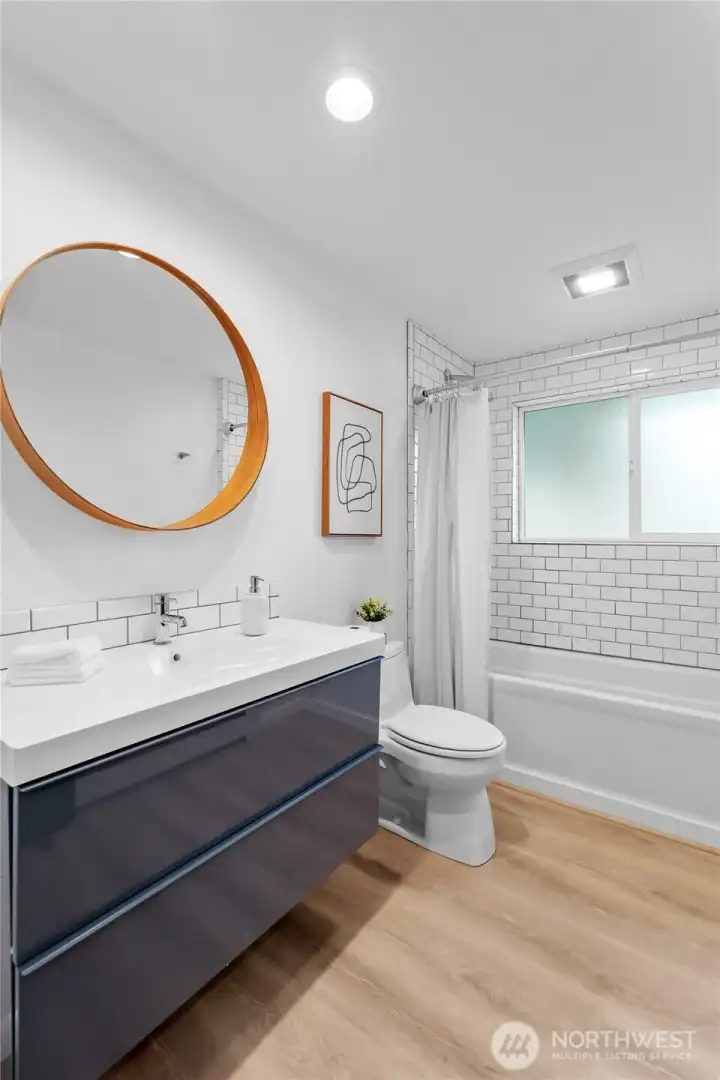 GUEST BATHROOM | Located off the front hallway this bathroom is conveniently located for guests.