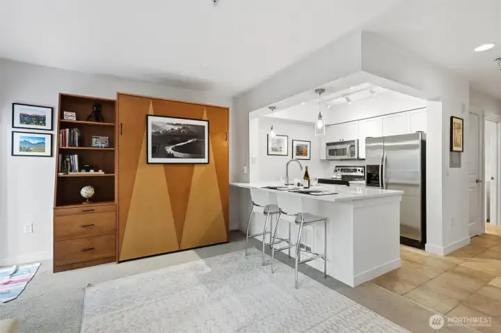 Updated Kitchen, Murphy bed and custom shelves.