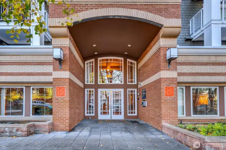 Secure entrance to Ballard Place.  Parking entrance in back.