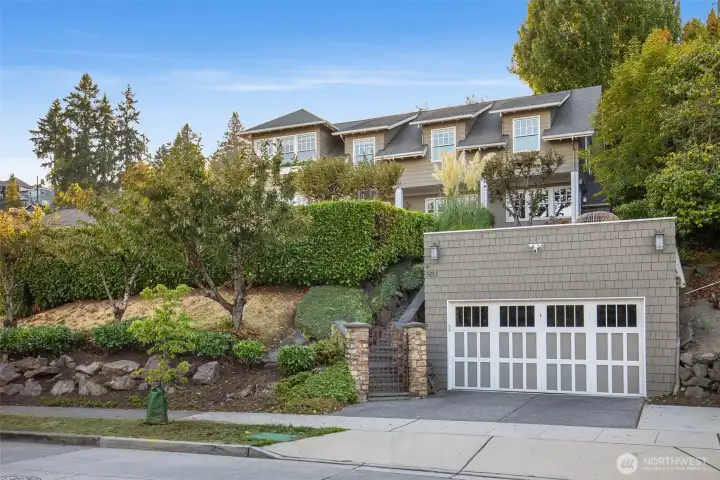 Street View showing garage and deck above.