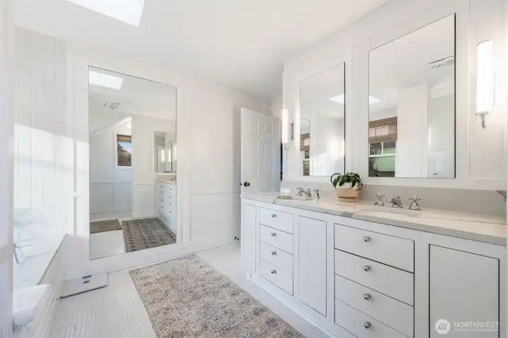 Primary bathroom with custom cabinets and programmable Sonneman Bauhaus lighting.