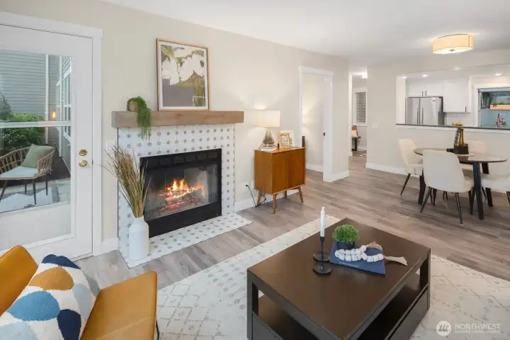 A wood-burning fireplace with reclaimed wood mantel and Moroccan tile creates an inviting focal point