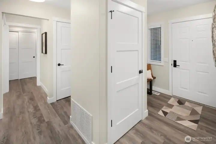 Light and Bright foyer with room for a bench; spacious hallway coat closet adds to the optimized storage in this thoughtfully laid-out condo.