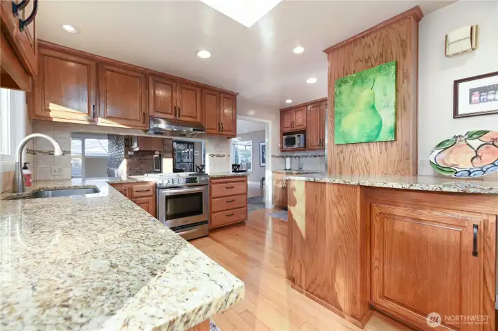 A truly unique kitchen designed for culinary creativity, featuring generous counter space, ample cabinetry, and abundant storage. This inspiring space has been the heart of catering for numerous parties, weddings, and fundraising events.