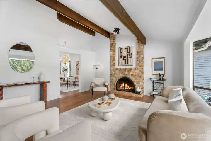 Wood fireplace & a large bay window with natural light.