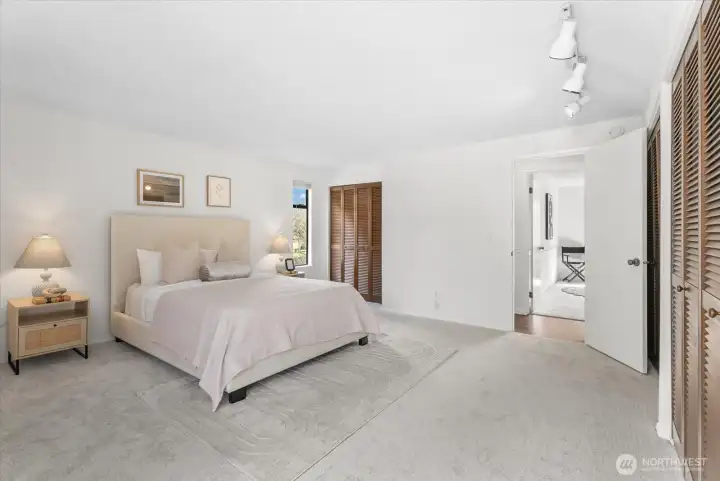 The spacious master suite with double closets & ensuite bath with shower